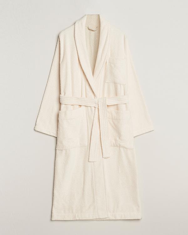 White trench coat from Tekla
